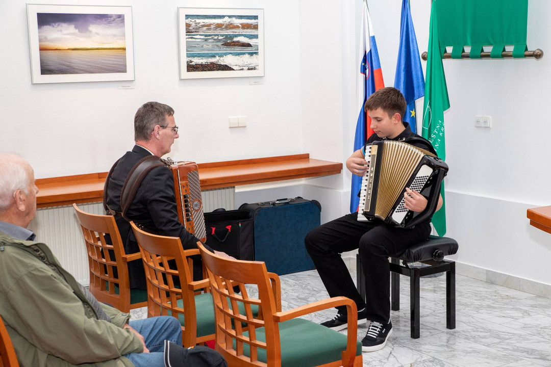 Odprtje razstave fotografij Vinka Šebreka